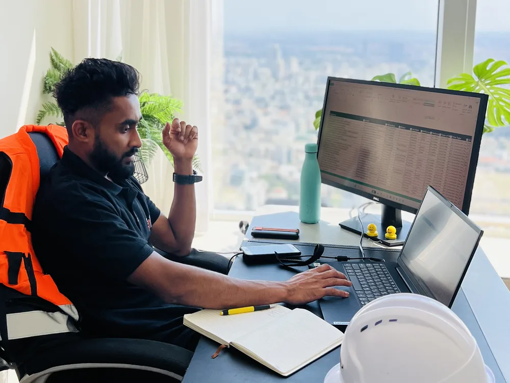 Payroll and workforce records on Dilash's desk overlooking Tel Aviv